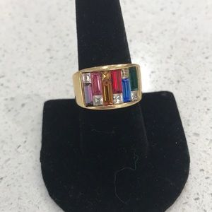 Multi color glass stones with a gold band.